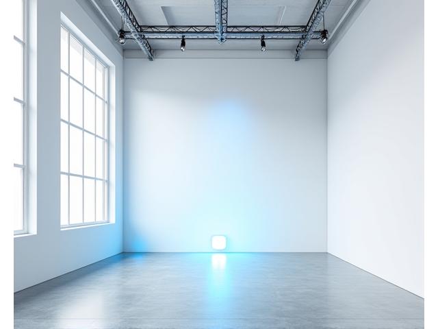 A modern, versatile creative studio space with adaptable lighting and minimalist design